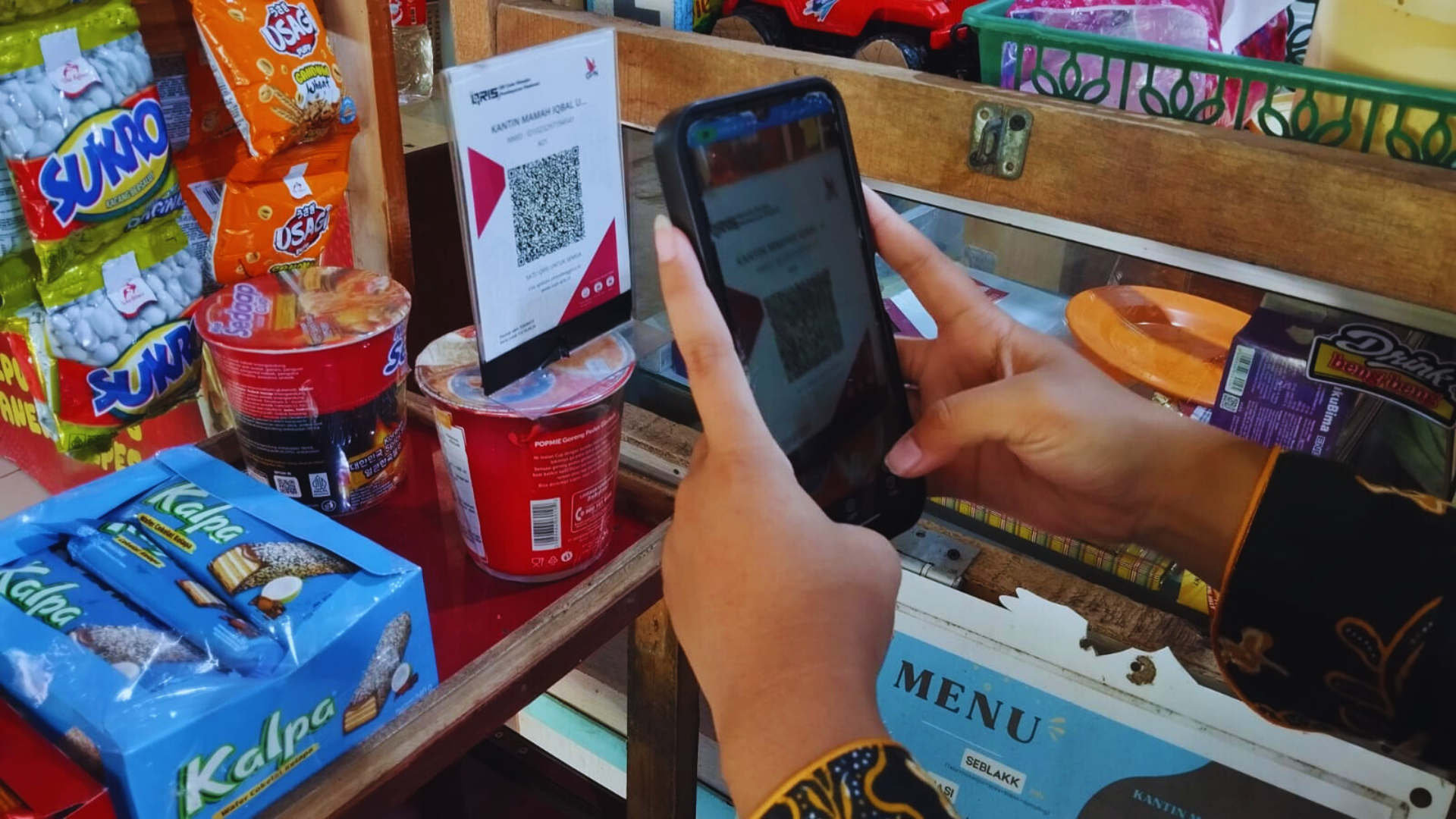 Pedagang Keluhkan Lambatnya Pembayaran QRIS